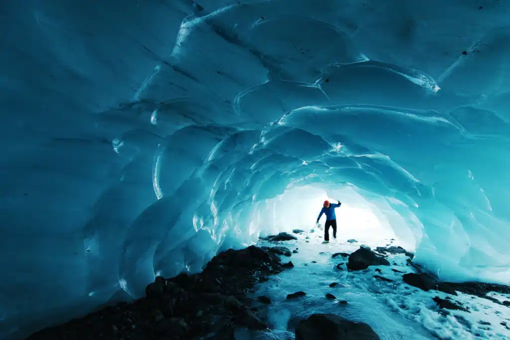 A person in an ice cave is wondering how to get shipping to Alaska.