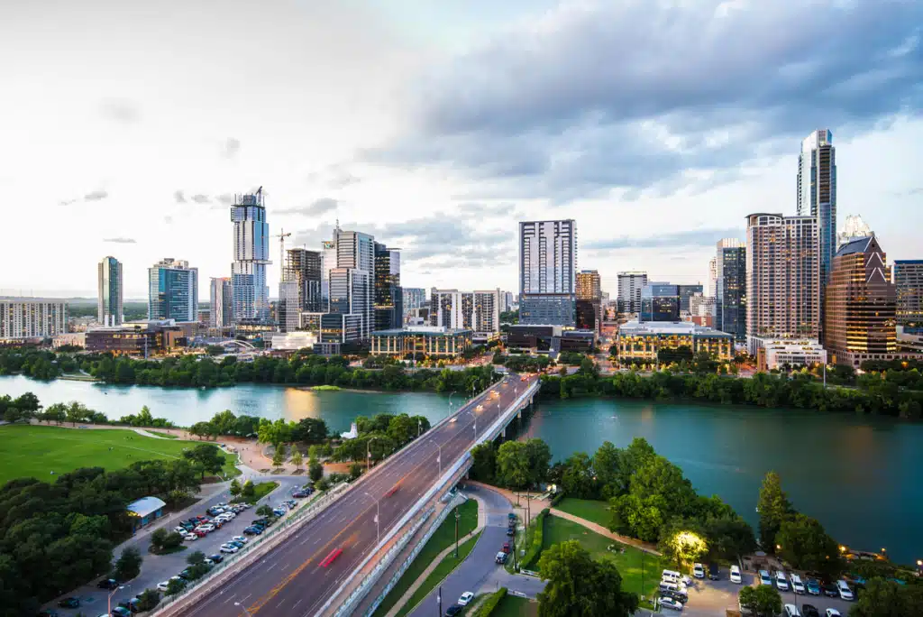 A view of a city skyline in Austin Texas during a sunny day. Traffic is clear, and Austin Texas Forwarding Services are more accessible than ever with PostFromUS.