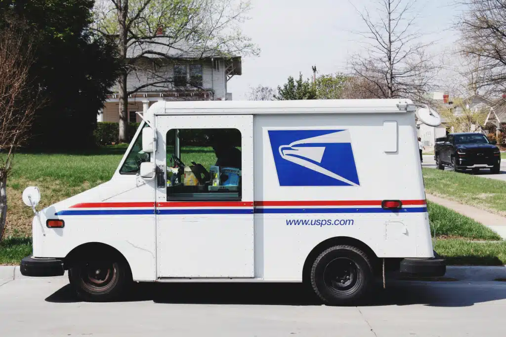 A USPS driver is delivering mail to a resident. Avoid wondering what tie does the mail come in my area with these tips.