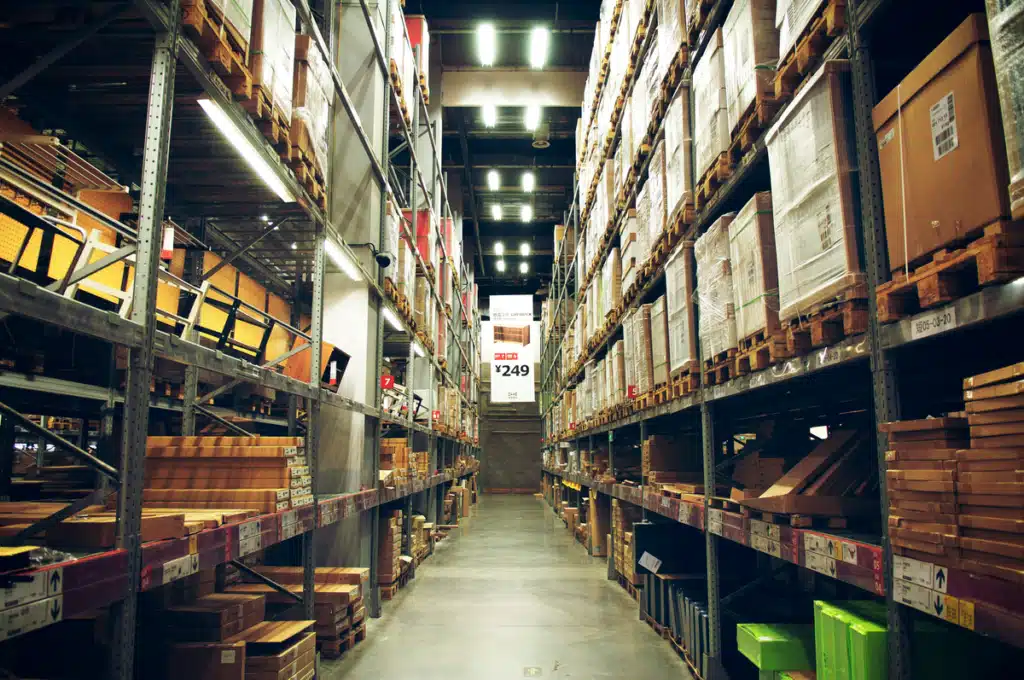 The interior of an IKEA warehouse that does not ship to Hawaii. The shelves are very high and fully stocked.