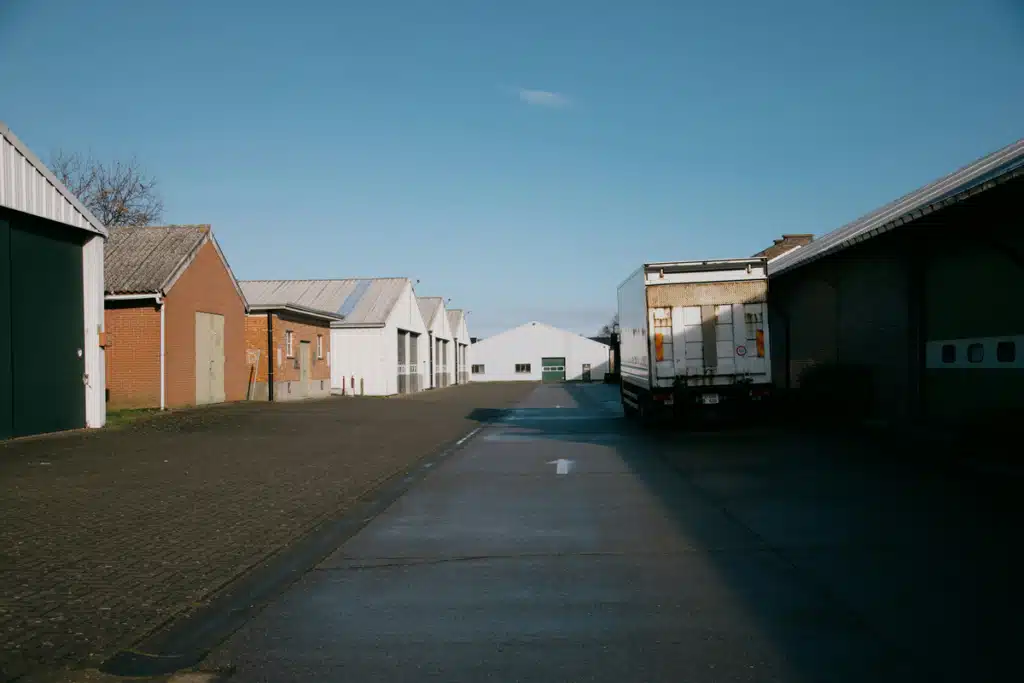 A small warehouse lot with a truck pulling up, perfect size for shipping for small business.