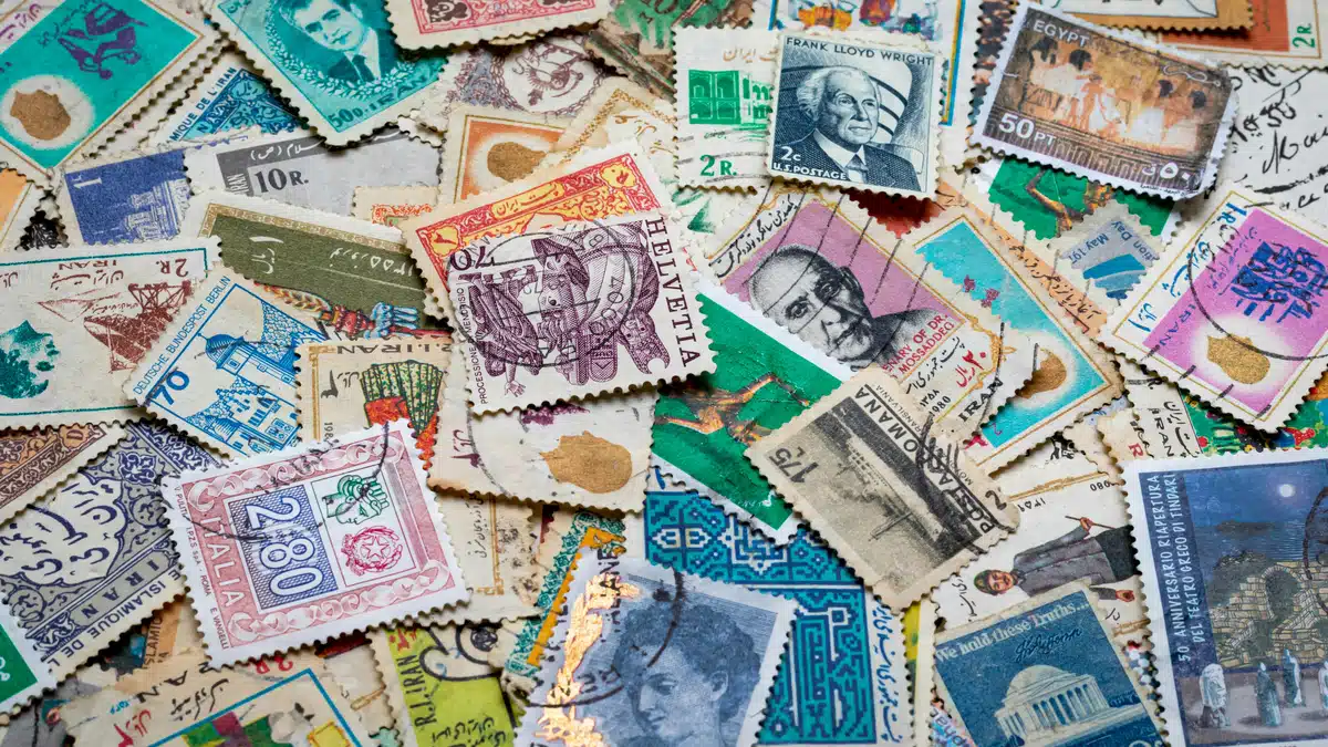 Postage stamps in array, in preparation for postage to Hawaii.