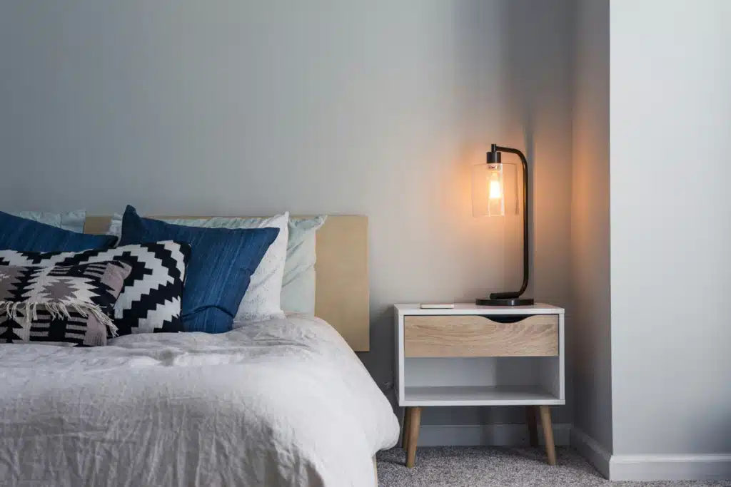 A clean, decorated bedroom in Alaska is filled with homegoods shipped from Wayfair.