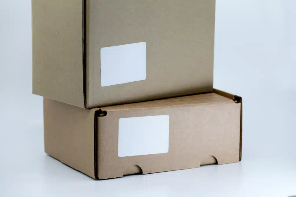 Two prepared and labelled packages on a white background, which is a perfect example for shipping boxes overseas.