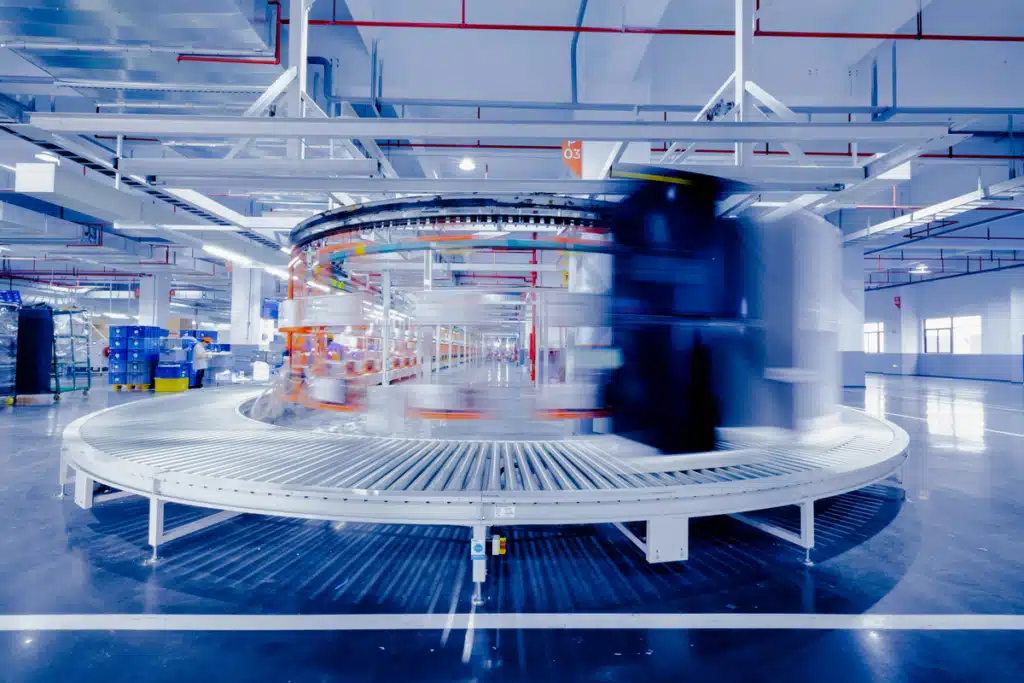 A conveyor belt in a factory, signifying the order fulfillment process.