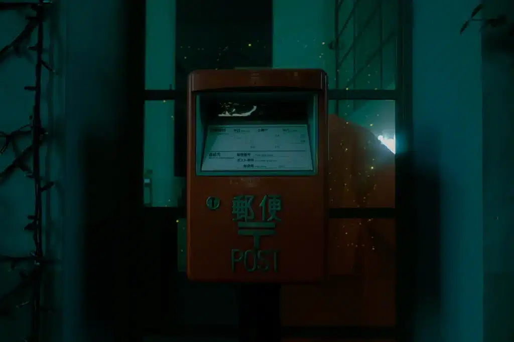 A Tokyo mailbox at night.