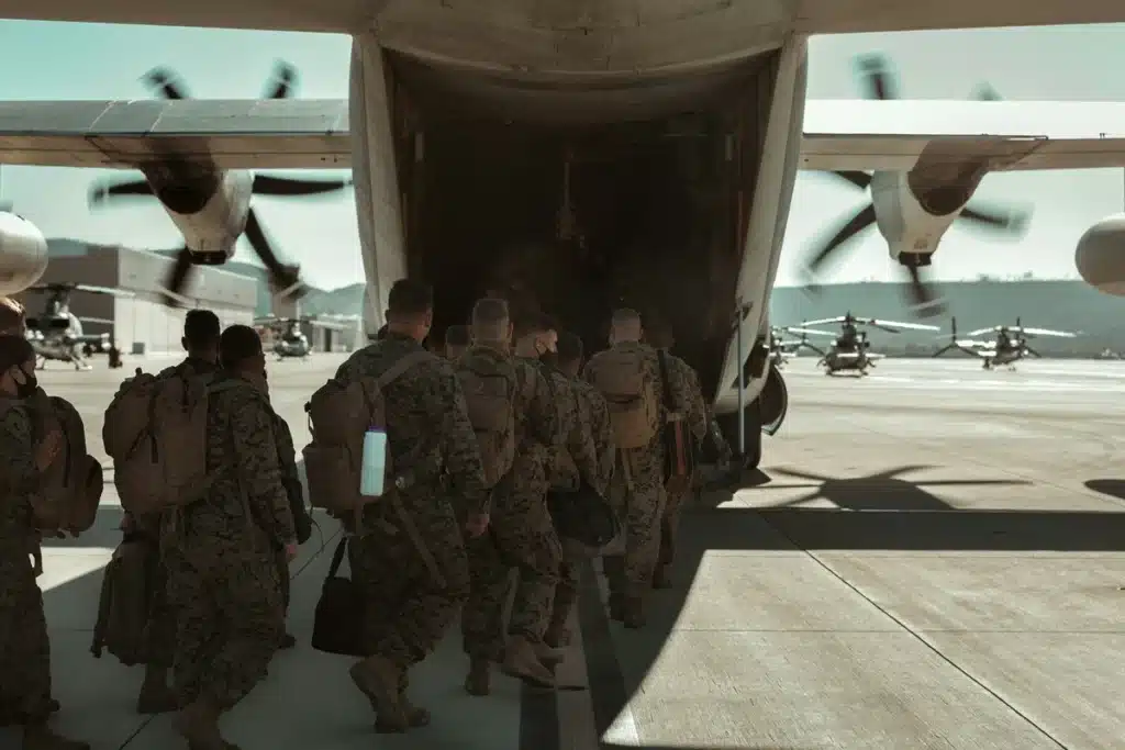 US Marine troops are boarding a small plane to go to Iwakuni marine base housing.