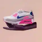 Nike slip-resistant shoes on a peach background are floating above a cut-out of a hand, like a collage.