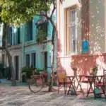 A cafe with street furniture (a bistro table and two chairs), which is easy to Ship to Spain from USA if a specific style is wanted by the owner.