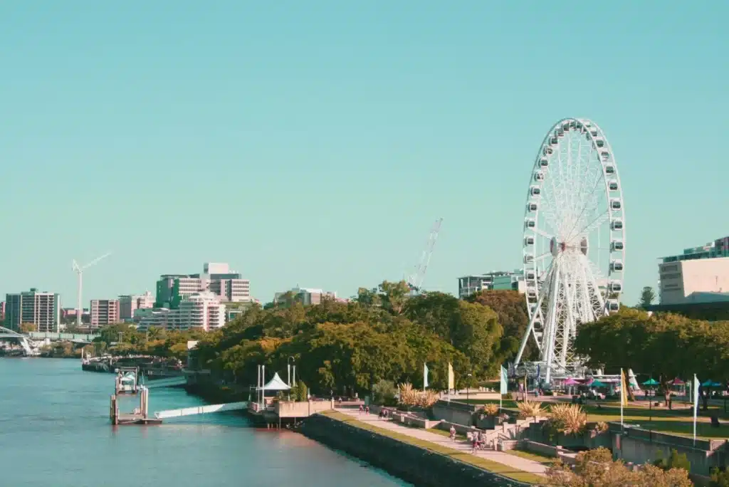 A Ferris wheel along a waterway in Brisbane, Australia.